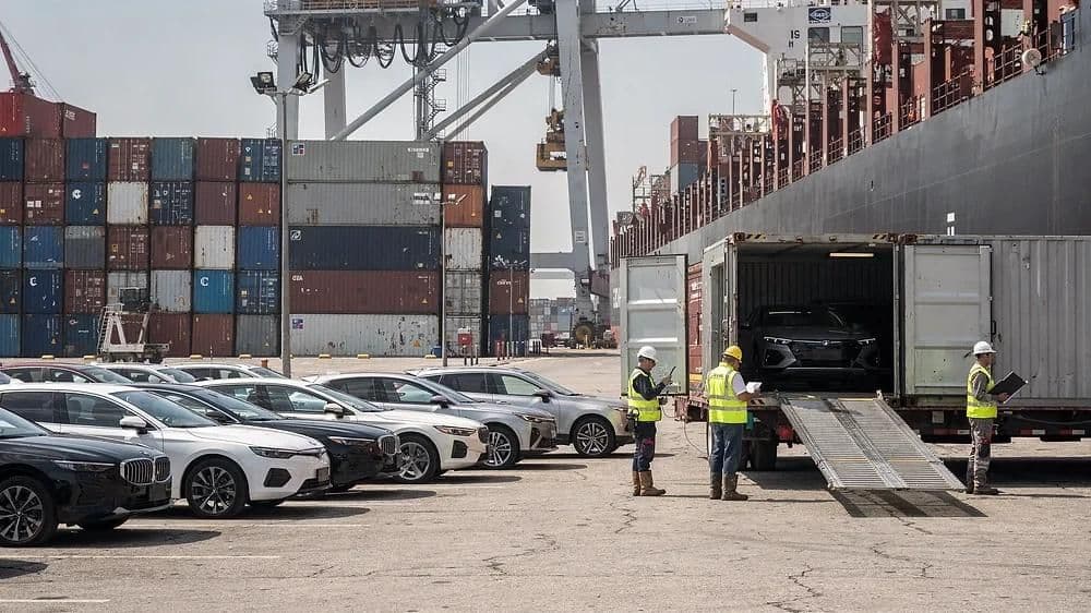 Loading vehicles into containers at the terminal