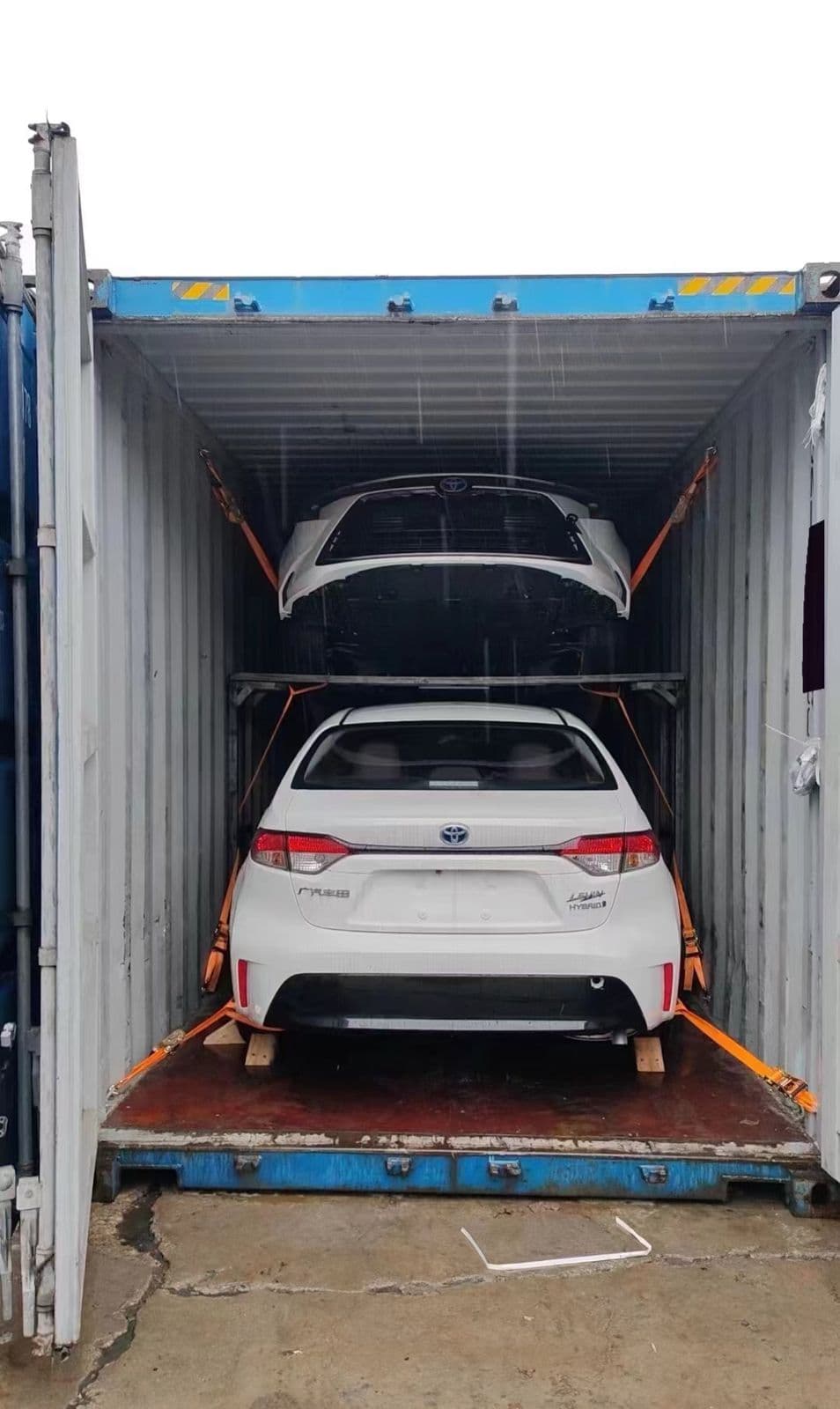 Toyota Corolla secured inside a shipping container