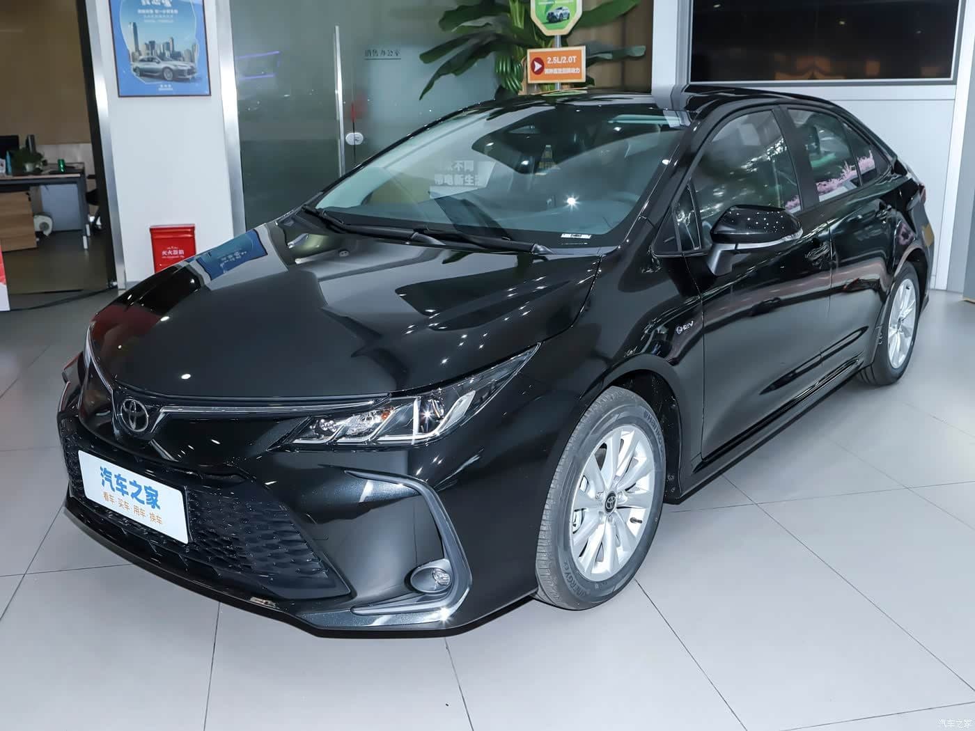 2024 Toyota Corolla 1.8L Hybrid in Black Mica, front three-quarter view — hybrid sedan for export