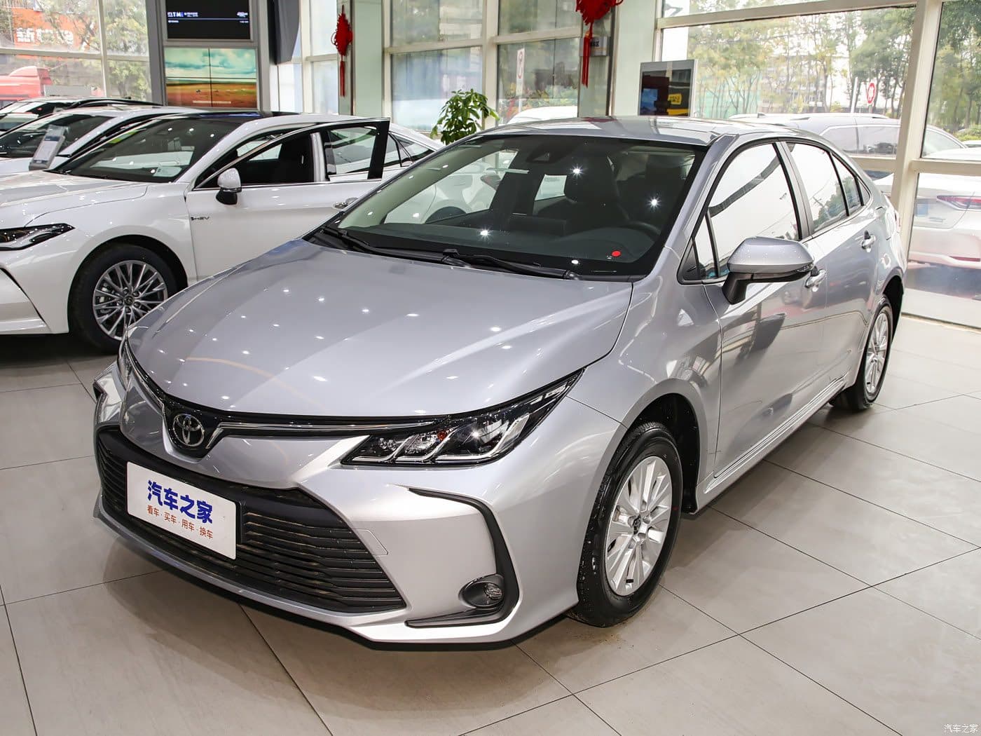 2024 Toyota Corolla petrol in Charm Silver, front three-quarter view — sedan for export
